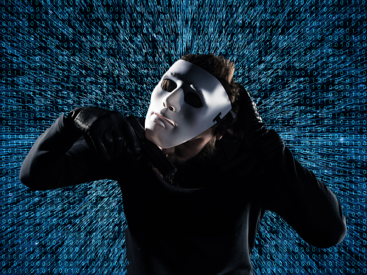 man taking off mask in front of digital background