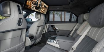 Interior back seat inside of the 2022 BMW i7 with a smart display installed.