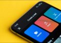 Facebook Reels app on a smartphone on a yellow background