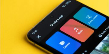 Facebook Reels app on a smartphone on a yellow background