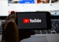 YouTube logo on a smartphone