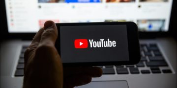 YouTube logo on a smartphone