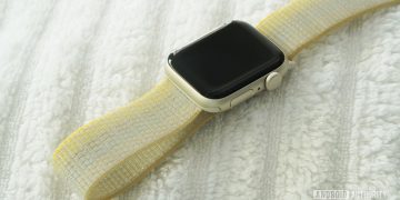 An Apple Watch SE 2 dries on a white towel.