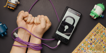 USB A to USB C cable wrapped around wrists connected to phone with lock icon