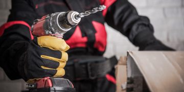 Power tool drill on construction side