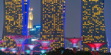 Singapore Downtown skyline at night. Financial district and business centers in technology smart urban city in Asia. Skyscraper and high-rise buildings.